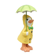 Divertente anatra in resina in piedi con ombrellone all'aperto